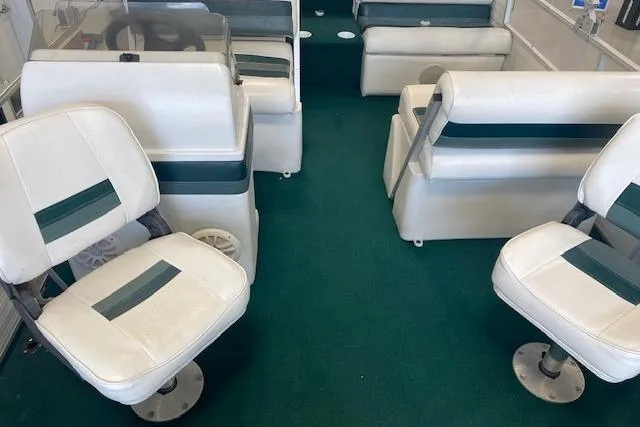 Slide: The Image of Interior of 2001 Odyssey Pontoons 1703 Millennium with white and green seating. - 10