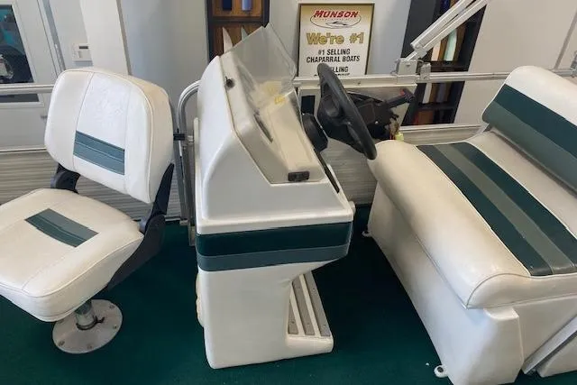 Slide: The Image of 2001 Odyssey Pontoons 1703 Millennium boat interior with white and green seating. - 13