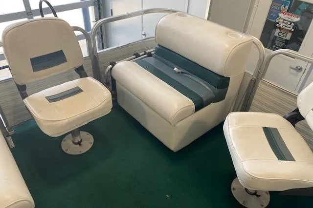 Slide: The Image of 2001 Odyssey Pontoons 1703 Millennium interior with white and green seating on green carpet. - 15