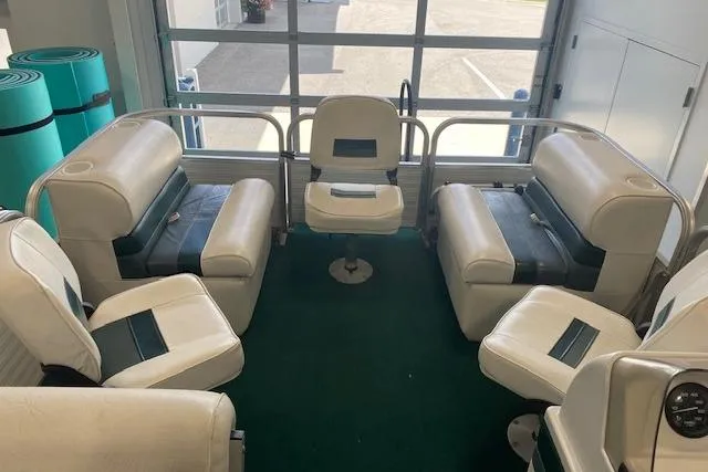 Slide: The Image of 2001 Odyssey Pontoons 1703 Millennium interior with white and blue seating arrangement. - 6