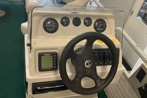 Slide: The Image of 2001 Odyssey Pontoons 1703 Millennium dashboard with steering wheel and gauges. - 7