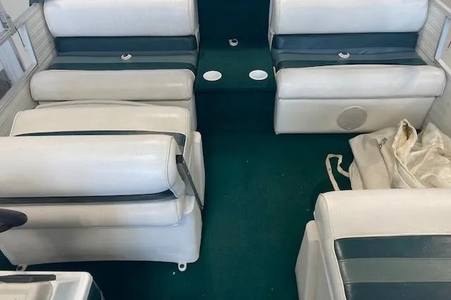 Slide: The Image of Interior of 2001 Odyssey Pontoons 1703 Millennium with white and green seating. - 9