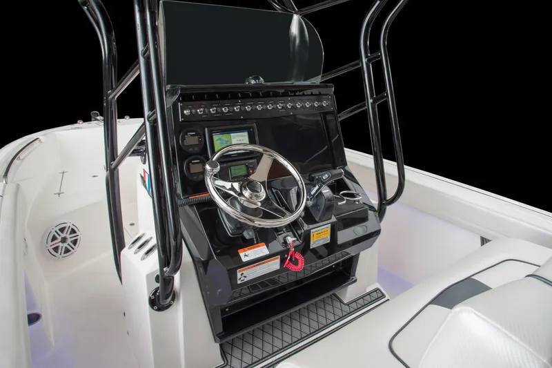 Slide: The Image of Manufacturer Provided Image: 2017 Wellcraft 222 Fisherman boat console with steering wheel and navigation controls. - 11