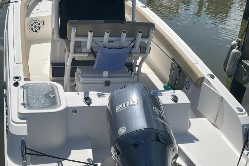 Slide: The Image of 2017 Wellcraft 222 Fisherman boat with Yamaha 200 engine, docked by the water. - 3