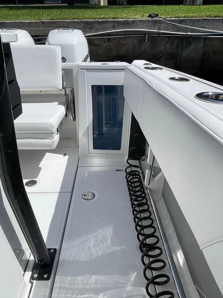 Slide: The Image of 2019 Blackfin 272 CC boat interior with seating and storage compartments. - 14