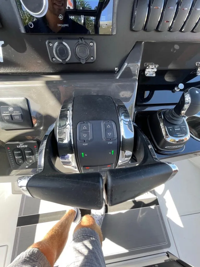 Slide: The Image of Close-up of 2019 Blackfin 272 CC boat controls and steering wheel. - 21