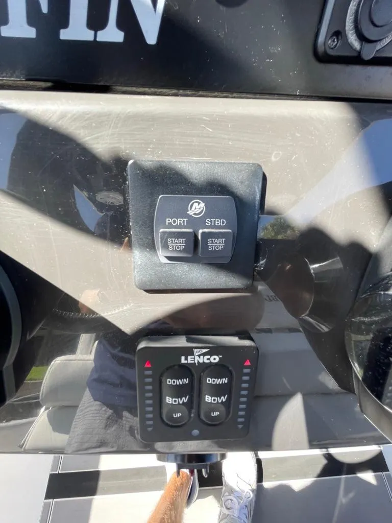 Slide: The Image of Control panel of a 2019 Blackfin 272 CC boat with Lenco trim tab switches. - 23