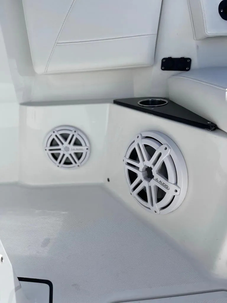 Slide: The Image of 2019 Blackfin 272 CC boat interior with speakers and cup holder. - 24