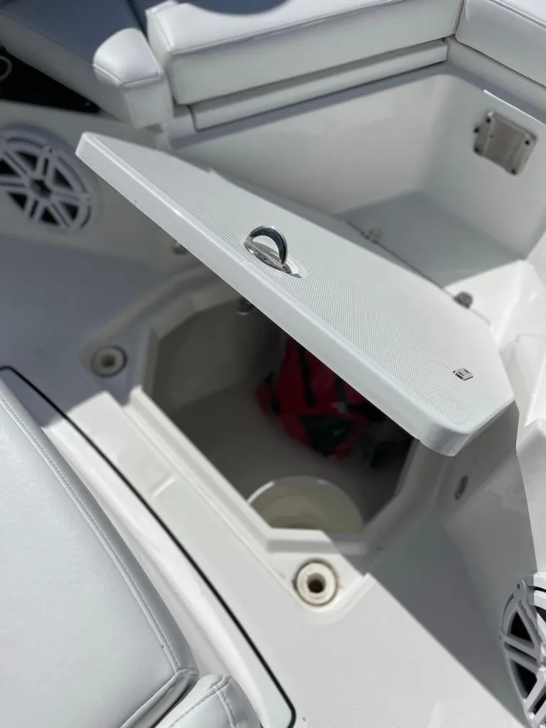 Slide: The Image of 2019 Blackfin 272 CC boat storage compartment with open lid, showcasing interior space. - 39