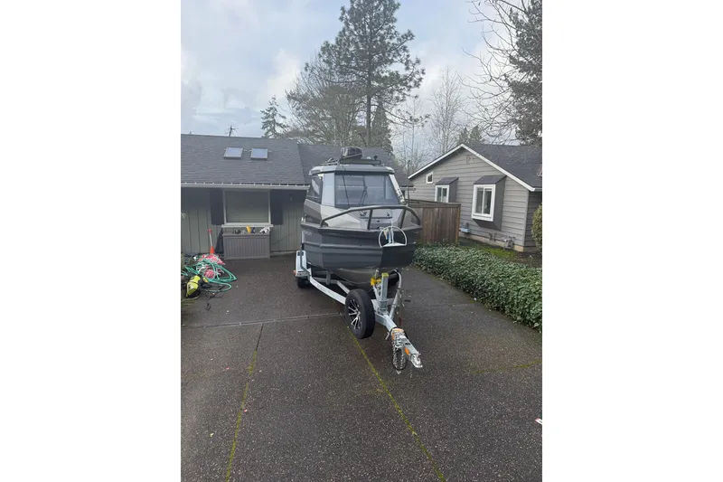 The Image of 2024 Stabicraft 2050 Supercab boat on trailer in residential driveway. - 1