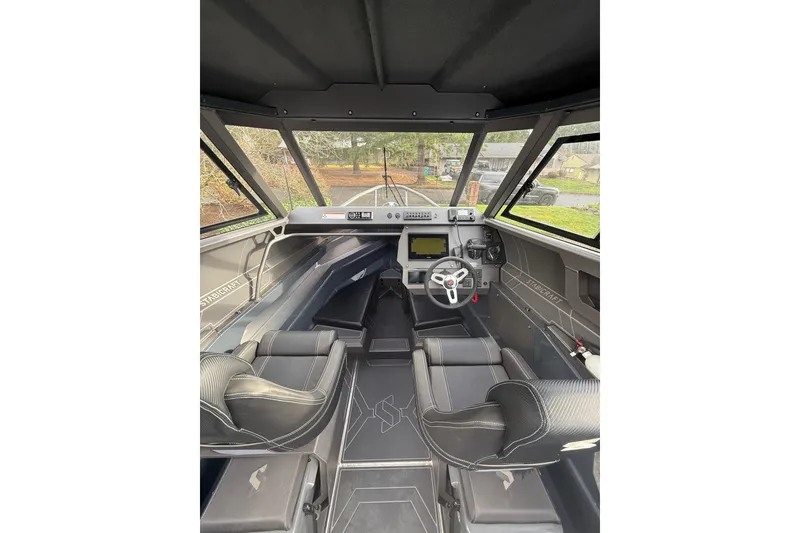 Slide: The Image of 2024 Stabicraft 2050 Supercab interior with modern dashboard and seating. - 12