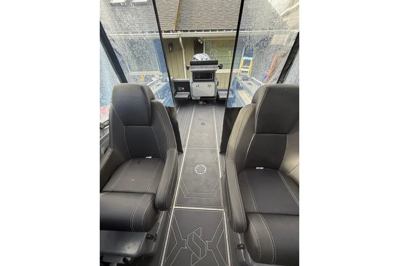 Slide: The Image of 2024 Stabicraft 2050 Supercab interior with black seating and modern design. - 17