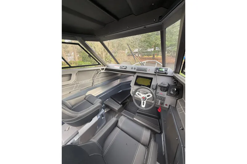 Slide: The Image of 2024 Stabicraft 2050 Supercab interior with modern dashboard and steering wheel. - 18