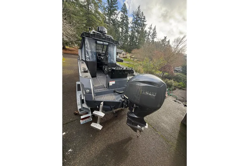 Slide: The Image of 2024 Stabicraft 2050 Supercab boat with Yamaha outboard motor, parked outdoors. - 4