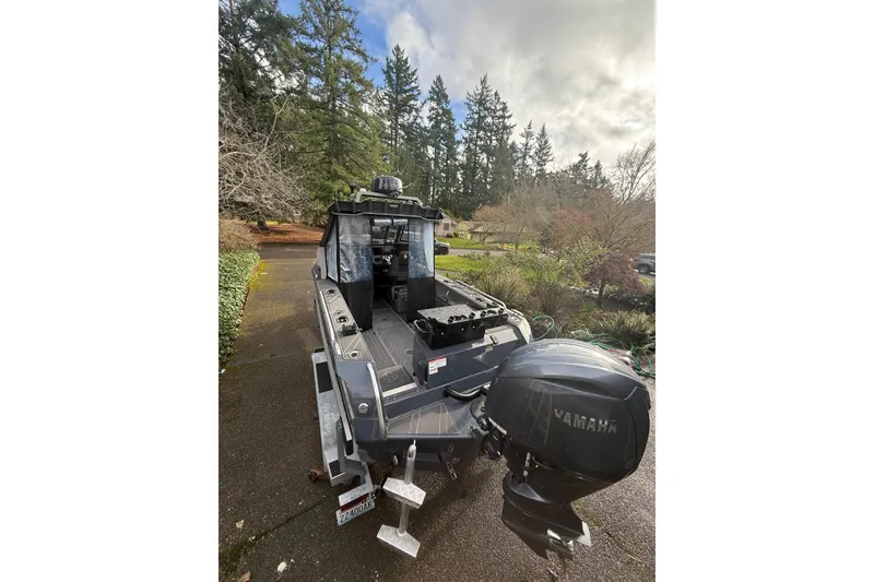 Slide: The Image of 2024 Stabicraft 2050 Supercab boat with Yamaha engine, parked outdoors. - 5