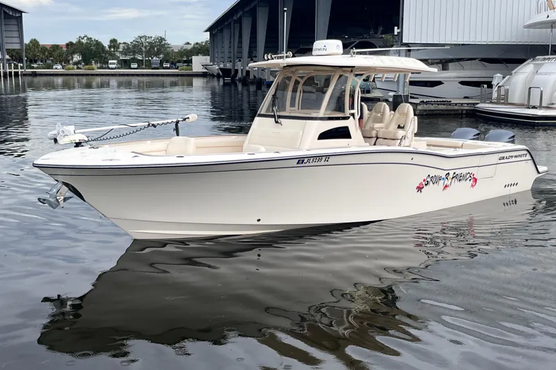 The Image of 2020 Grady-White Canyon 326 boat docked on calm water. - 0
