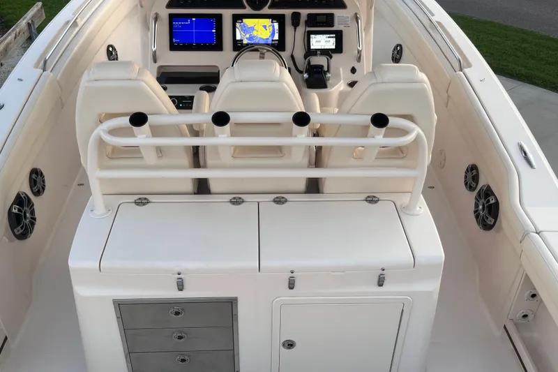Slide: The Image of 2020 Grady-White Canyon 326 boat interior with helm, seating, and storage compartments. - 13