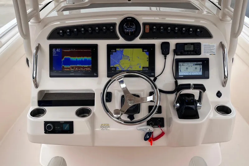 Slide: The Image of Control panel of 2020 Grady-White Canyon 326 boat with navigation and communication systems. - 14
