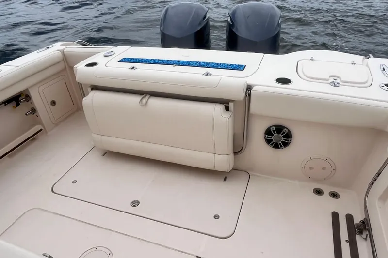 Slide: The Image of 2020 Grady-White Canyon 326 boat interior with seating and dual outboard motors. - 20