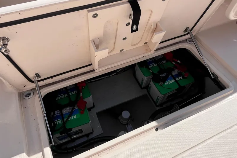 Slide: The Image of 2020 Grady-White Canyon 326 boat battery compartment with Interstate batteries. - 23