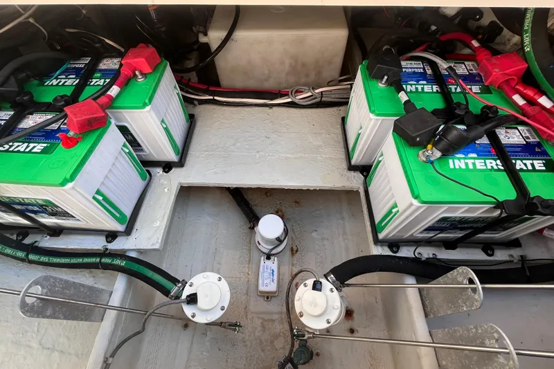 Slide: The Image of 2020 Grady-White Canyon 326 boat battery compartment with Interstate batteries. - 24