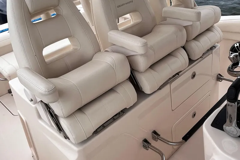 Slide: The Image of Luxurious seating on a 2020 Grady-White Canyon 326 boat, featuring plush white upholstery. - 27