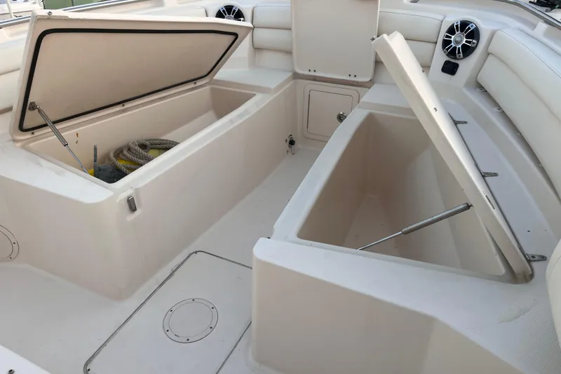Slide: The Image of 2020 Grady-White Canyon 326 boat interior with open storage compartments. - 29