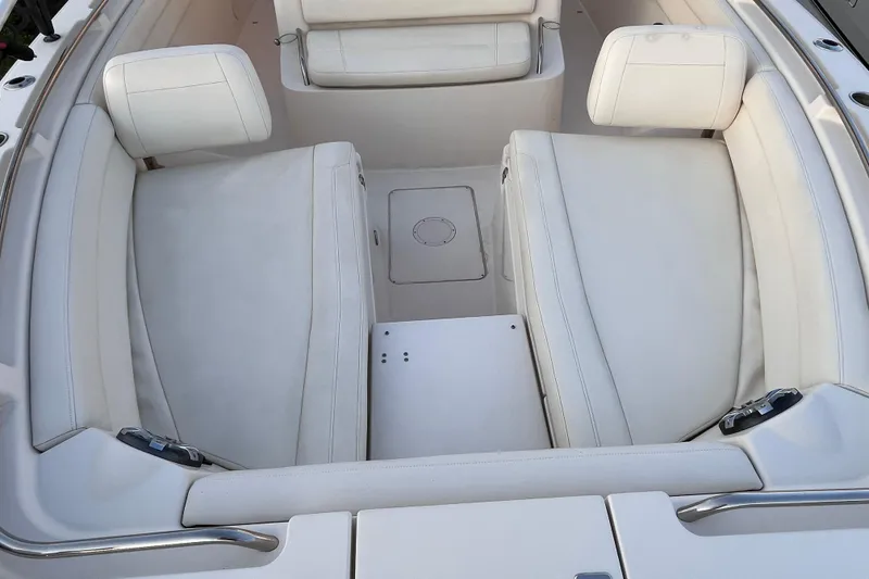 Slide: The Image of 2020 Grady-White Canyon 326 boat interior with white cushioned seating. - 31
