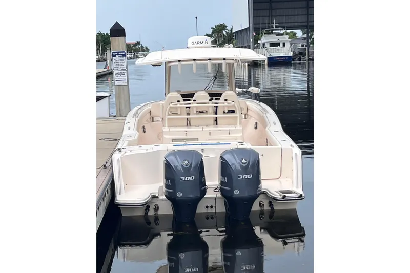 Slide: The Image of 2020 Grady-White Canyon 326 boat docked with twin Yamaha 300 engines. - 4