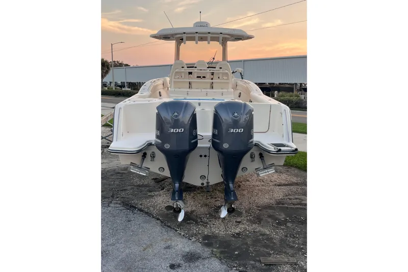 Slide: The Image of 2020 Grady-White Canyon 326 boat with dual Yamaha 300 engines at sunset. - 7