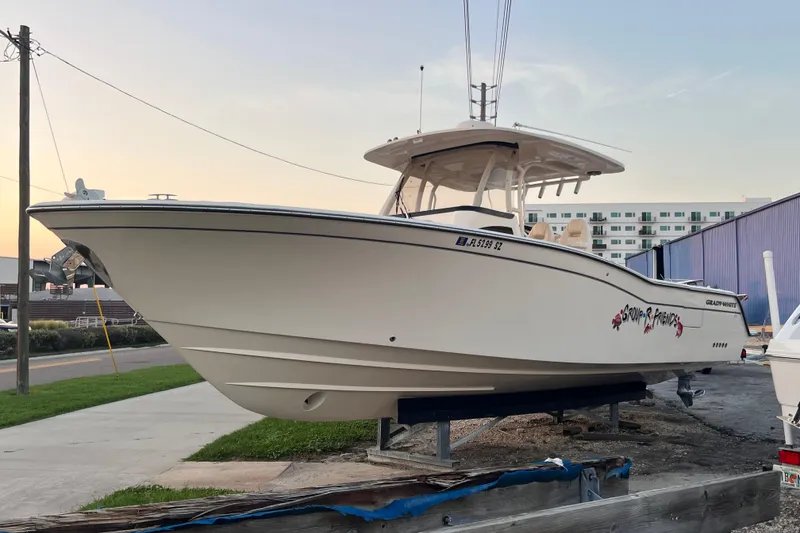 Slide: The Image of 2020 Grady-White Canyon 326 boat on display at marina, side view. - 8