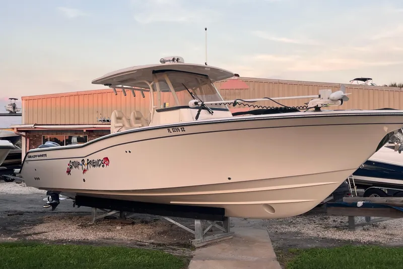 Slide: The Image of 2020 Grady-White Canyon 326 boat on display at a marina. - 9