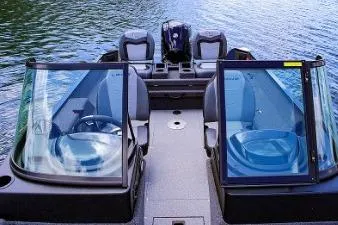 Slide: The Image of 2026 Lowe 1875 FM WT boat on water, featuring dual windshields and seating. - 6