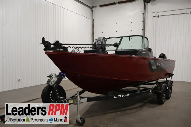 The Image of 2026 Lowe Fishing Machine 185 boat on trailer in indoor showroom. - 0