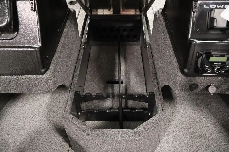 Slide: The Image of 2026 Lowe Fishing Machine 1875 interior, featuring rod storage and control panel. - 18