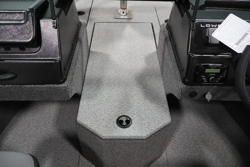 Slide: The Image of 2026 Lowe Fishing Machine 1875 interior, featuring a central console and storage area. - 19