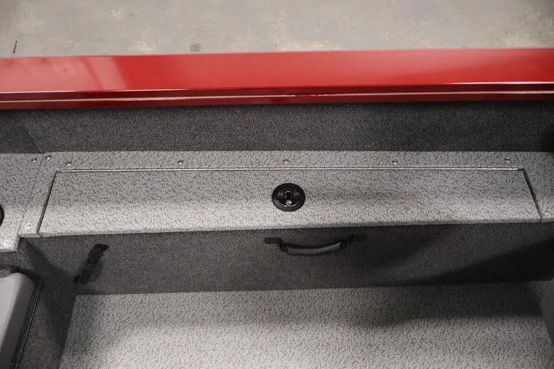 Slide: The Image of 2026 Lowe Fishing Machine 1875 interior storage compartment with red trim. - 31