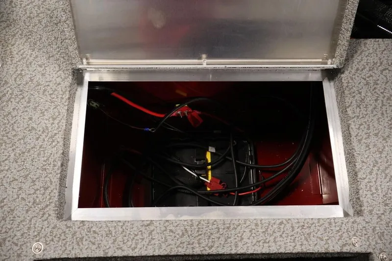 Slide: The Image of Open battery compartment of 2026 Lowe Fishing Machine 1875 boat, showing wiring and connections. - 37
