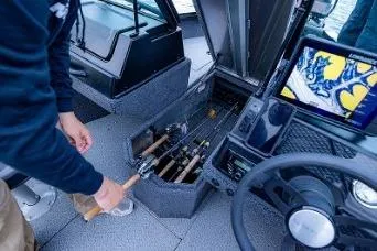 Slide: The Image of 2026 Lowe Fishing Machine 1875 boat in a garage, front view. - 4