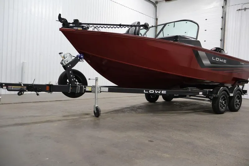 Slide: The Image of 2026 Lowe Fishing Machine 1875 boat on trailer in indoor setting. - 46