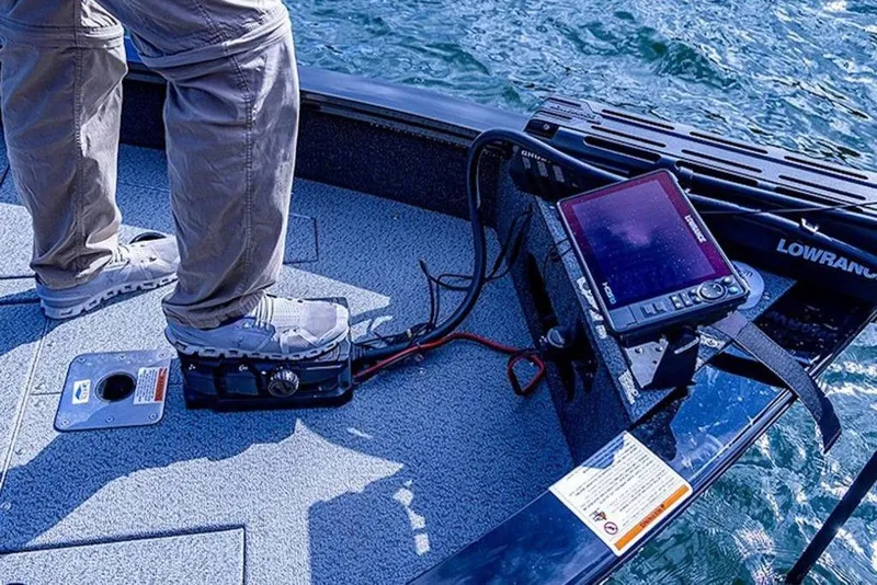 Slide: The Image of 2026 Lowe Fishing Machine 1875 boat with advanced navigation equipment on deck. - 51