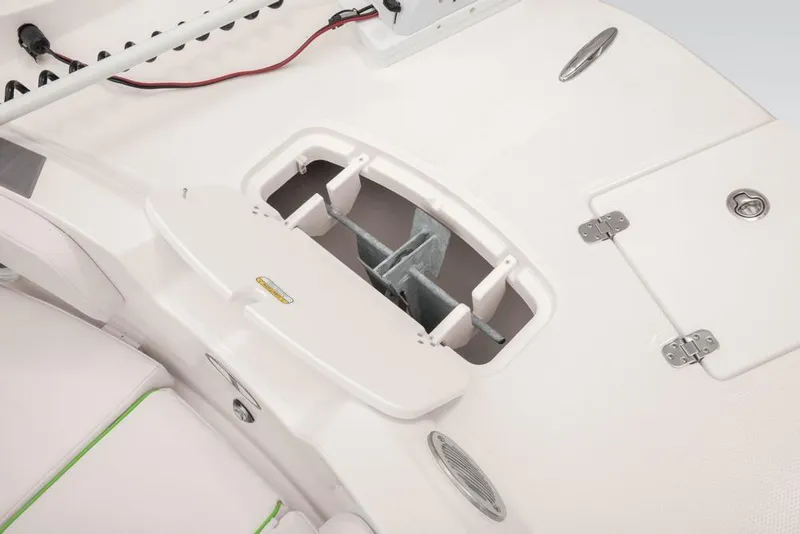 Slide: The Image of 2020 Tahoe 2150 CC boat interior with storage compartments and seating. - 29