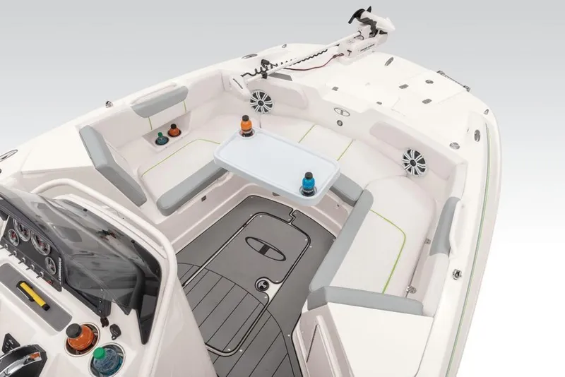 Slide: The Image of 2020 Tahoe 2150 CC boat interior with seating, table, and speakers. - 31
