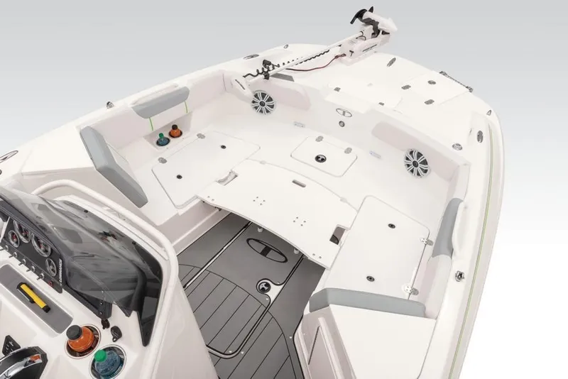 Slide: The Image of 2020 Tahoe 2150 CC boat interior with seating, storage, and control panel. - 32