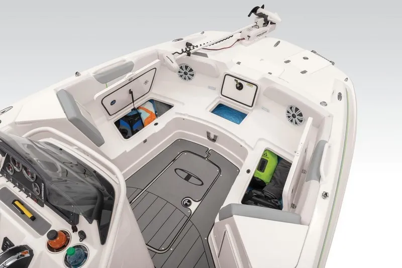 Slide: The Image of 2020 Tahoe 2150 CC boat interior with storage compartments and seating. - 34