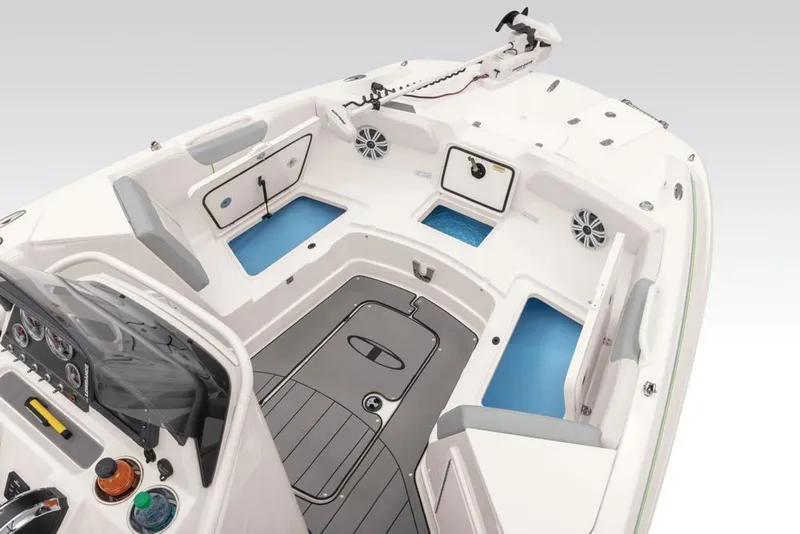 Slide: The Image of 2020 Tahoe 2150 CC boat interior with storage compartments and seating. - 35