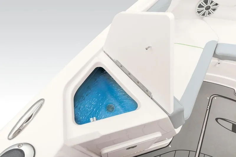 Slide: The Image of 2020 Tahoe 2150 CC boat interior with open storage compartment and blue water. - 37