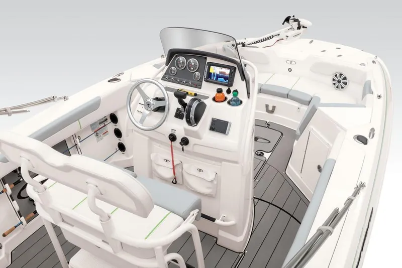 Slide: The Image of 2020 Tahoe 2150 CC boat interior with steering console and seating. - 46