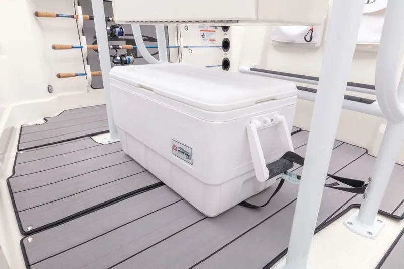 Slide: The Image of 2020 Tahoe 2150 CC boat interior with cooler on deck. - 49