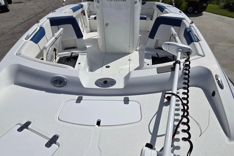 Slide: The Image of 2020 Tahoe 2150 CC boat interior with seating and fishing equipment. - 5